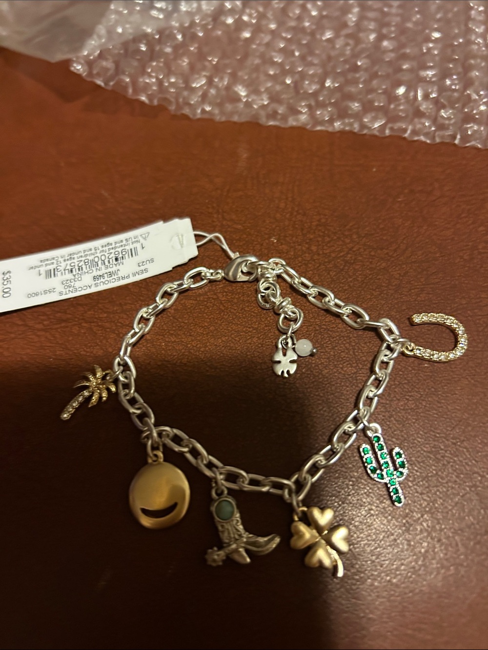 Lucky Brand Silver Charm Bracelet with Gold and Green Accents